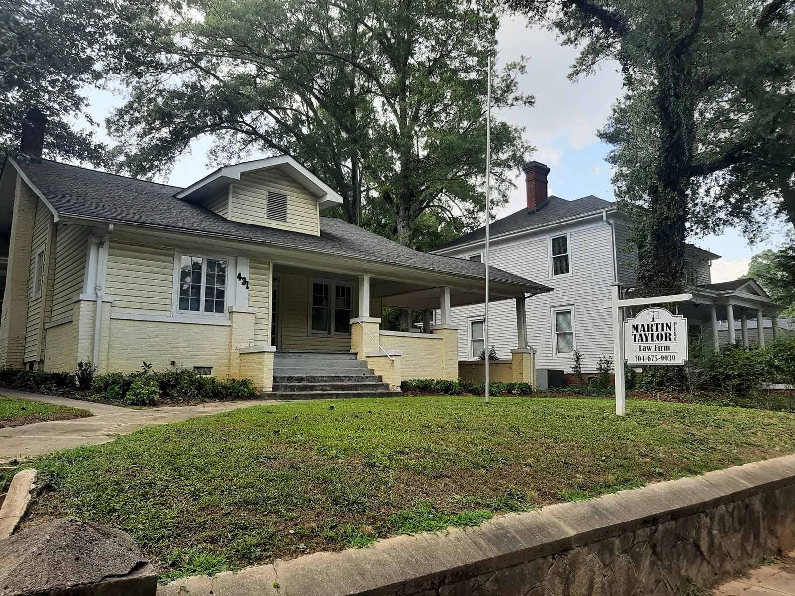 The yellow-house law office of Martin Taylor Law Firm at 431 South York Street in Gastonia